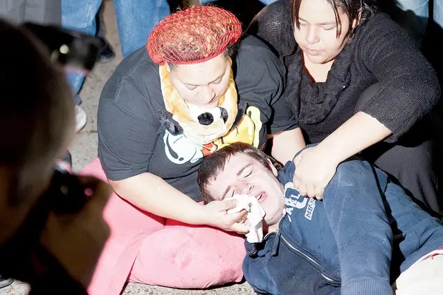 Anthony Hadden of Schenectady, NY, on the ground after being pepper sprayed